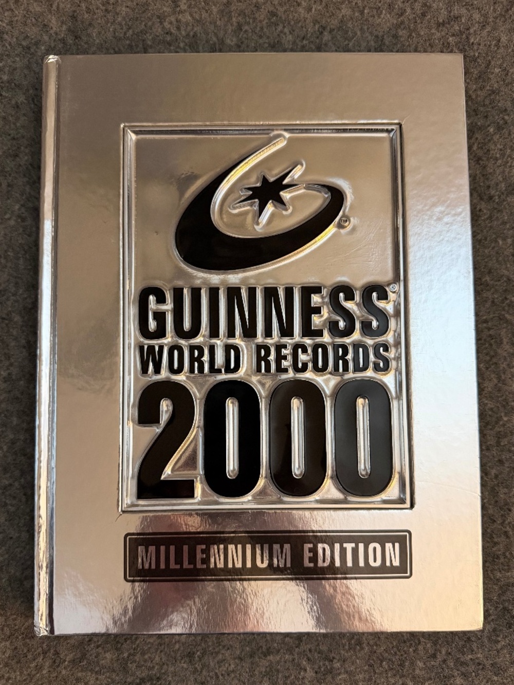 GUINNESS WORLD RECORDS 2000 Millennium Edition Silver Hardcover Book